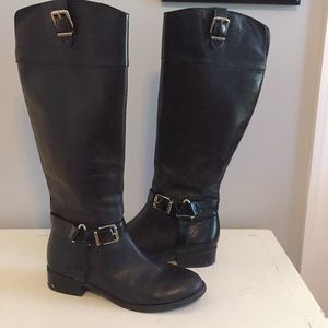 Tall , black , leather boots
